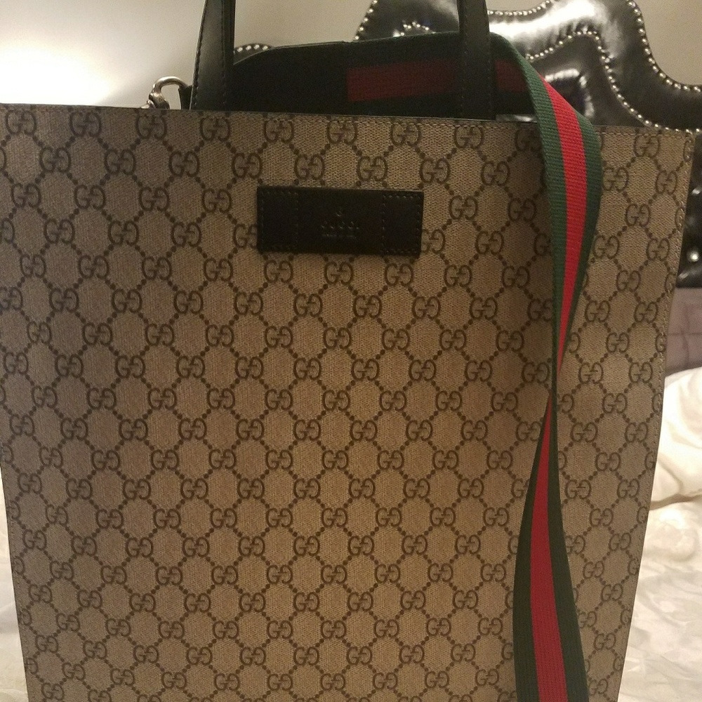 Authentic Gucci supreme tote with web strap detail